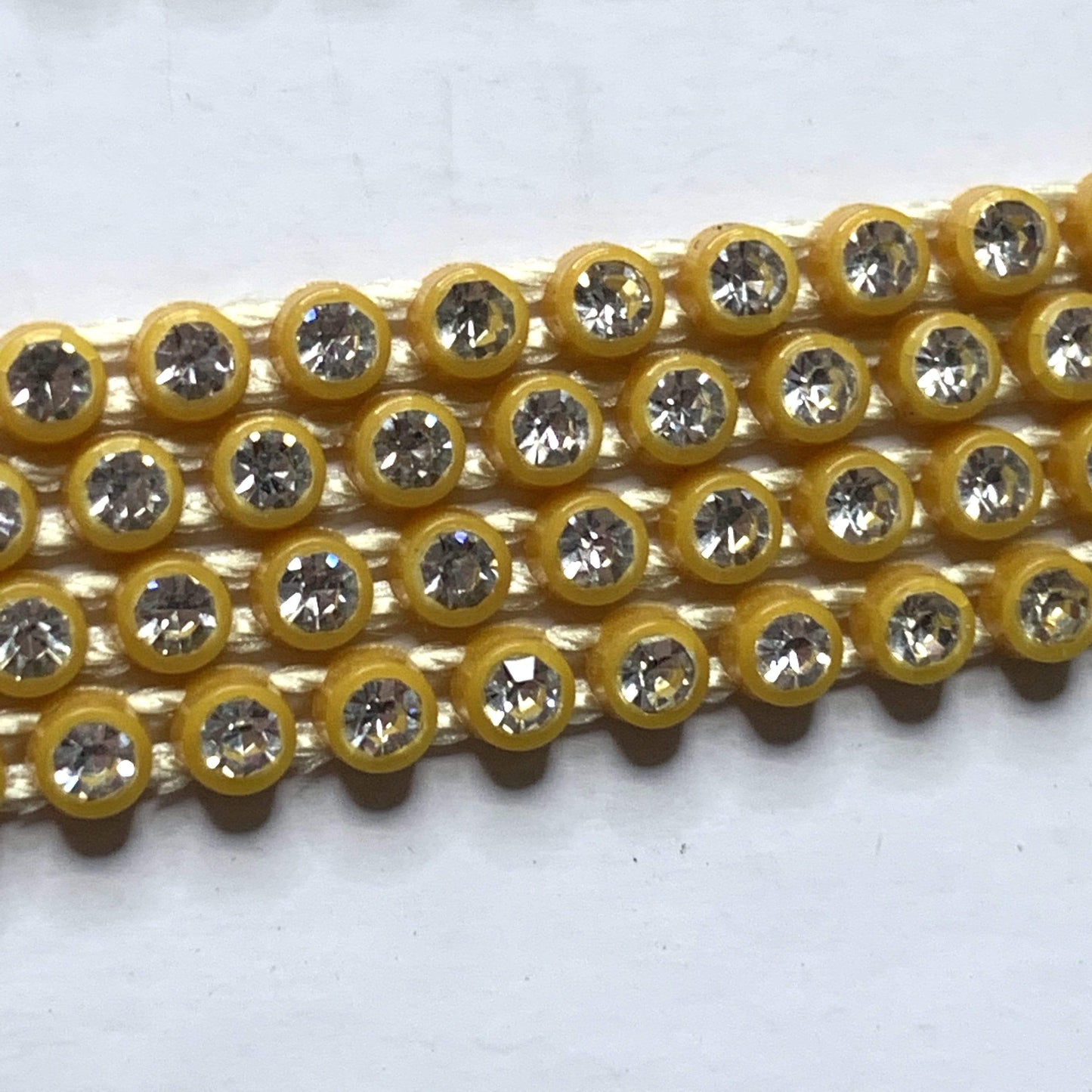 Sundaylace Creations & Bling Ss6 Plastic Rhinestone Banding Rope Gold/Topaz Ss6 Plastic Rhinestone Banding Chain Rope, CLEAR cut on various colours, Sold in yard