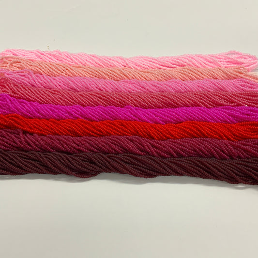 Stack of colorfu beads on a white background