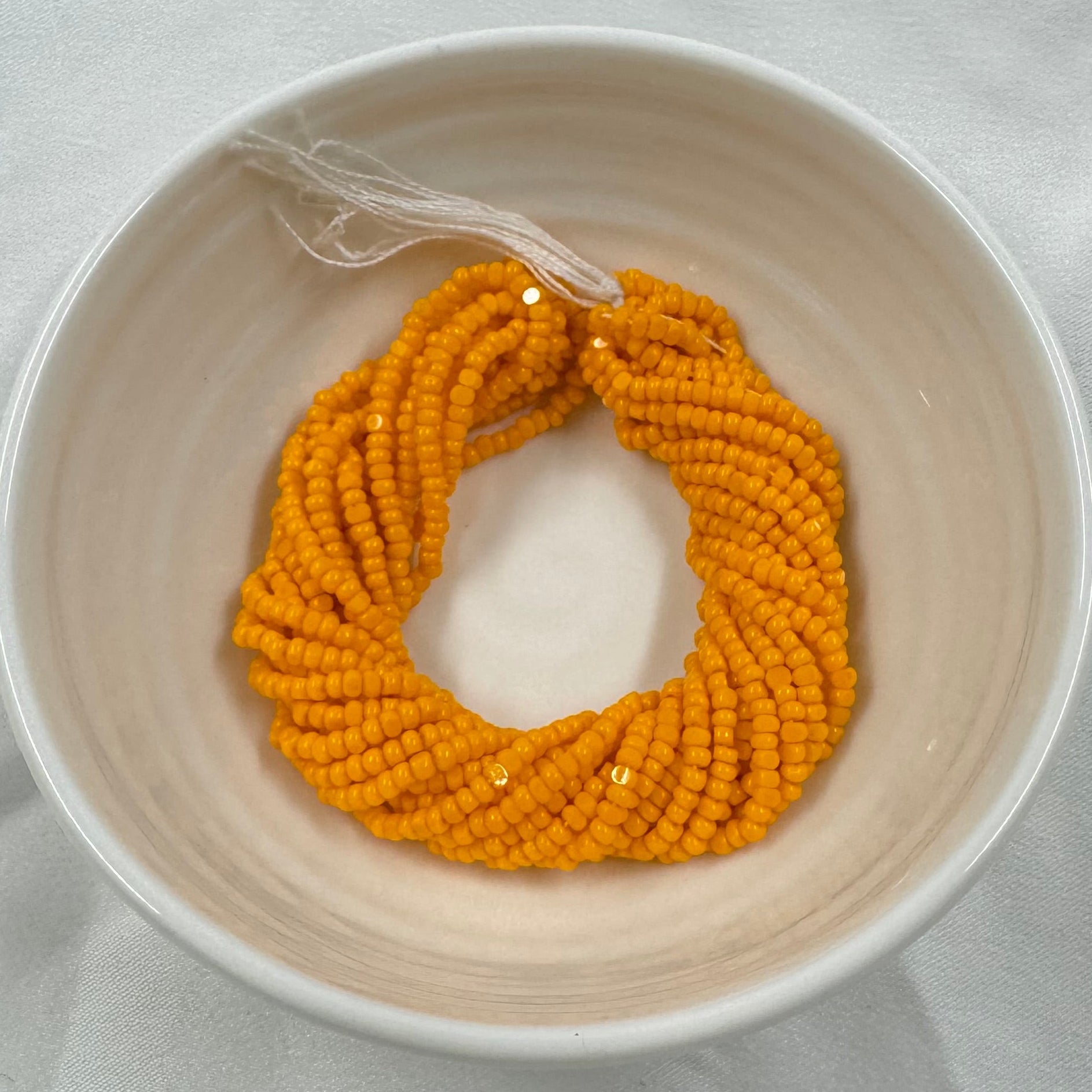 11/0 Charlotte Cut Seed Bead- Opaque Light Orange  *10g Hank* India Sheen Charlotte Cut Seedbeads