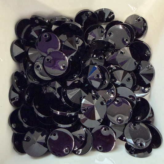 Black and purple sequins on a white background