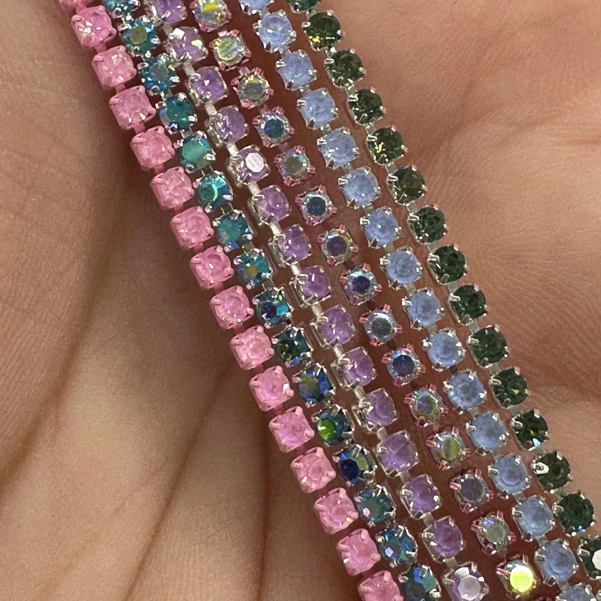 Close-up of a colorful beaded strip on a hand