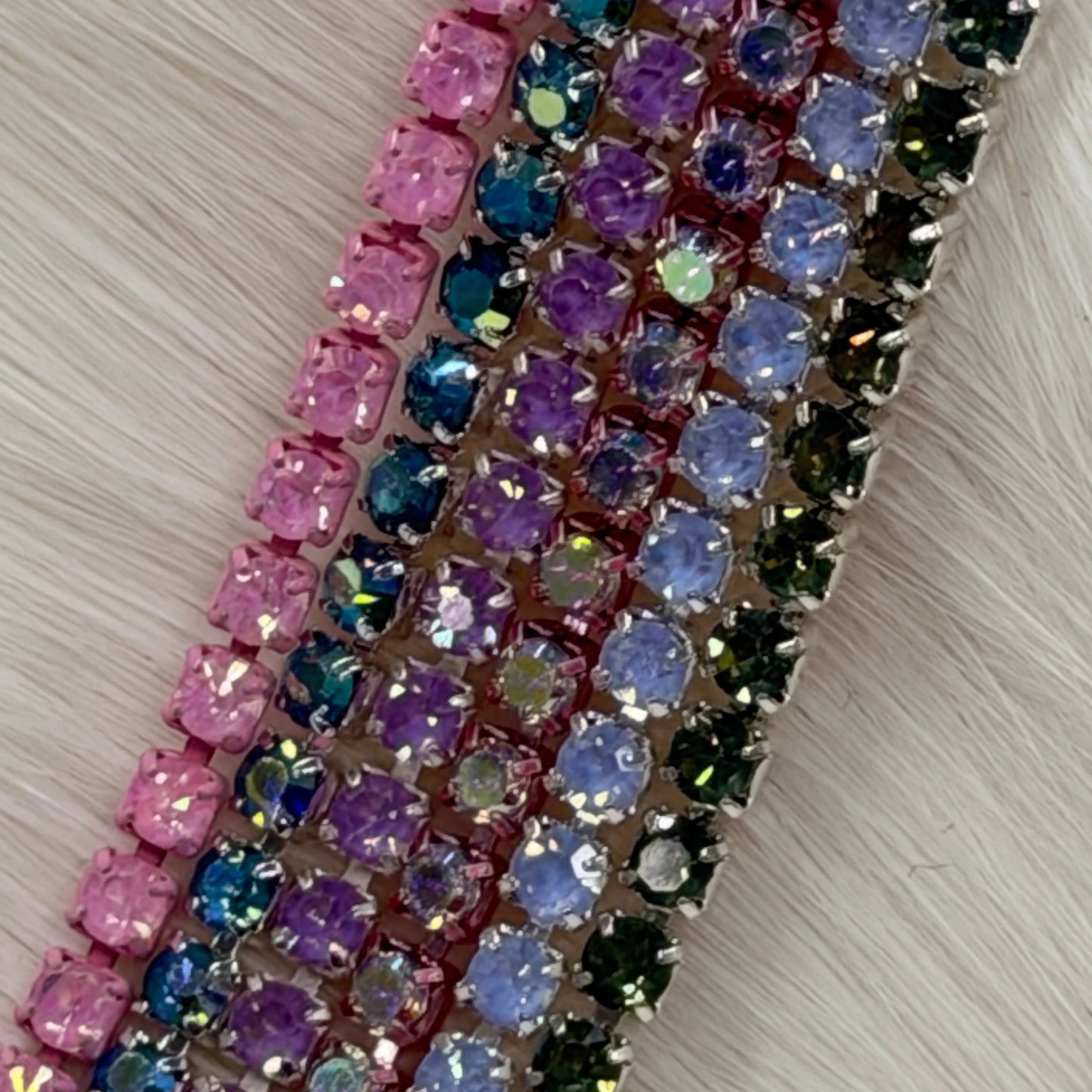 Multicolored beaded strip on a light wooden surface