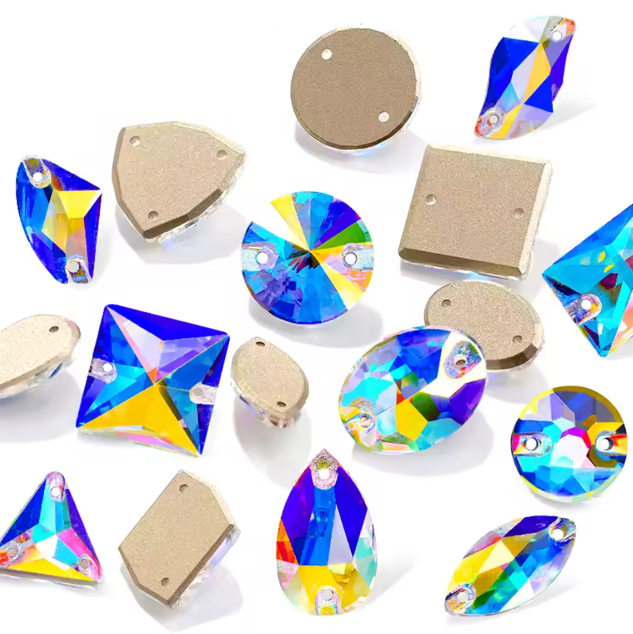 Assorted crystal stones with metal bases on a white background