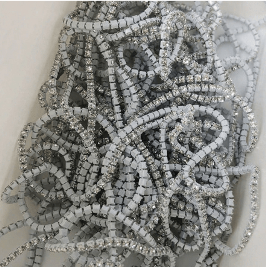 Sundaylace Creations & Bling SS6 Metal Rhinestone Chain Ss4 CLEAR stone on WHITE coloured Metal Rhinestone Chain, Sold 33"